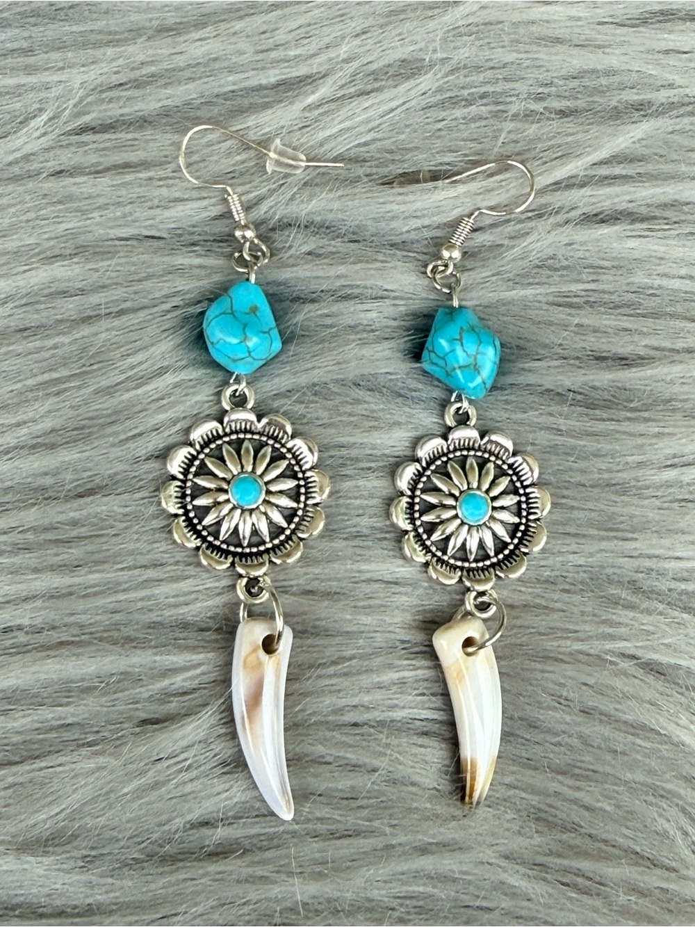Lainey Wilson inspired western turquoise concho coyote teeth dangle earrings.